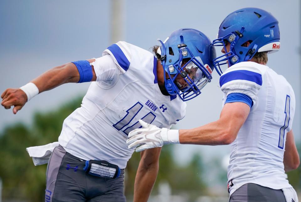The Barron Collier Cougars compete against the Southridge Spartans in a spring football game at Barron Collier High School in Naples on Wednesday, May 24, 2023.