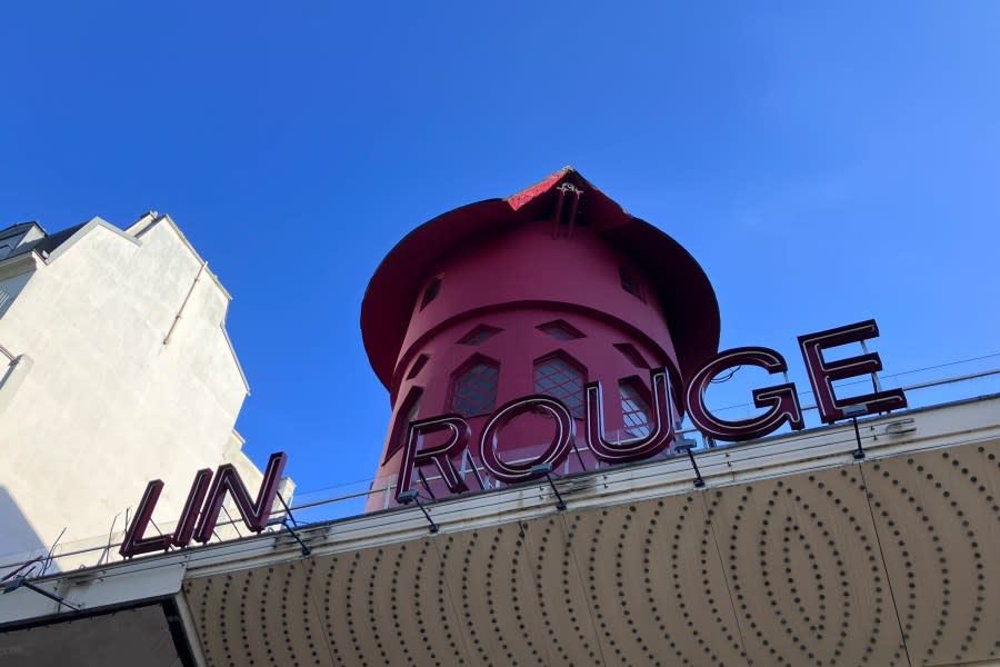 The facade of the Moulin Rouge (Red Mill) cabaret is seen Thursday, April 25, 2024 in Paris. The windmill from the Moulin Rouge, the 19th century Parisian cabaret, has fallen off the roof overnight along with some of the letters in its name. (AP Photo/Oleg Cetinic)