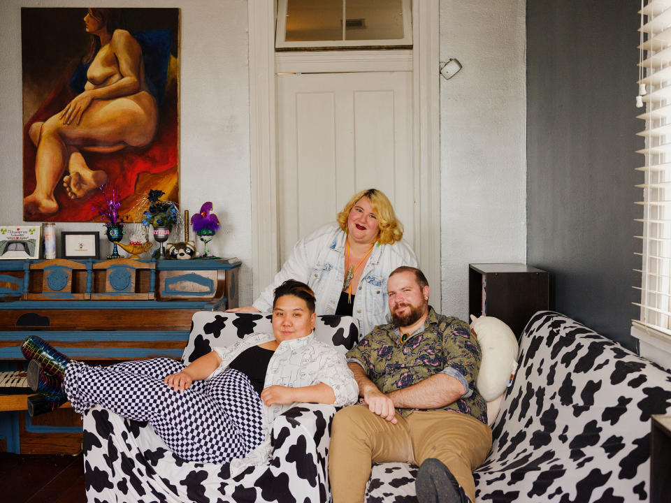 Jade (center), 29; Ami, 30; and Daniel, 33, pose for a portrait at their home in New Orleans on March 18, 2023.