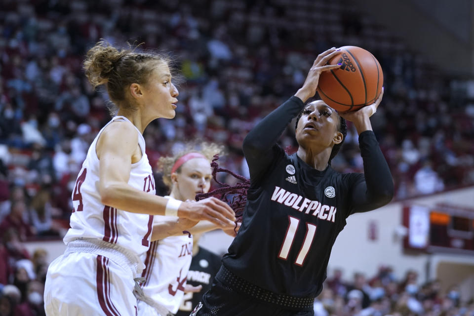 North Carolina State's Jakia Brown-Turner (11) shoots against Indiana's Ali Patberg (14) during the first half of an NCAA college basketball game Thursday, Dec. 2, 2021, in Bloomington, Ind. (Darron Cummings)