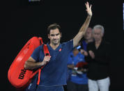 Switzerland's Roger Federer waves as he leaves Rod Laver Arena after losing his fourth round match against Greece's Stefanos Tsitsipas at the Australian Open tennis championships in Melbourne, Australia, Sunday, Jan. 20, 2019. (AP Photo/Mark Schiefelbein)