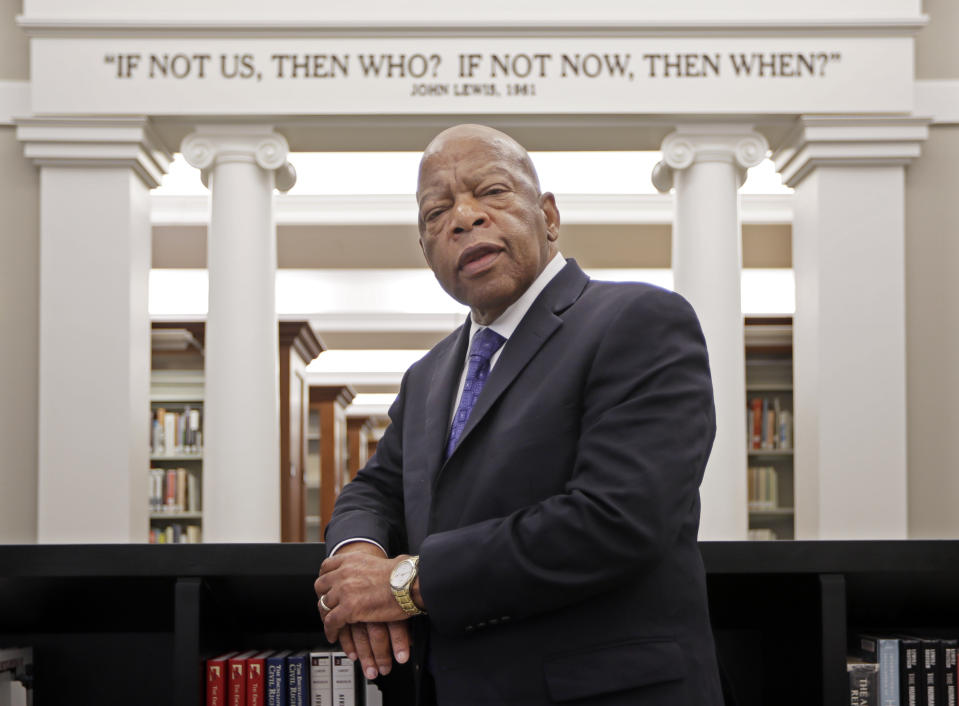 Rep. John Lewis, D-Ga., poses for a photograph under a quote of his that is displayed in the Civil Rights Room in the Nashville Public Library Friday, Nov. 18, 2016, in Nashville, Tenn.  (Photo: Mark Humphrey/AP)