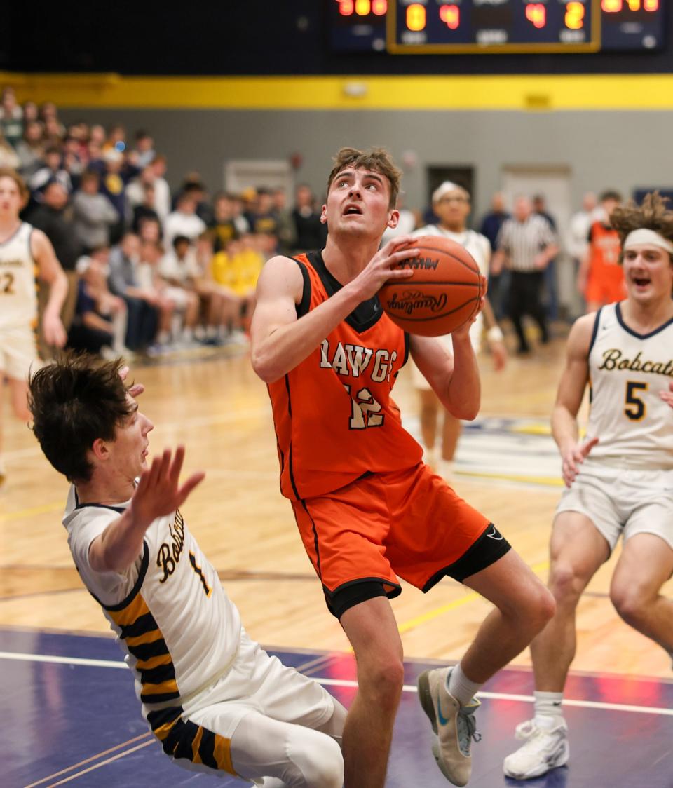 Summerfielld's Tyler Dafoe drives against Whiteford during a 60-49 Summerfield win Friday night.
