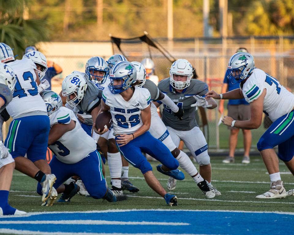 Barron Collier hosted Bonita Springs on Thursday, Sept. 14, 2023. The Cougars won 49-0. Bonita Springs' Chase Garcia runs the ball.