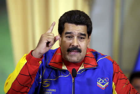 Venezuela's President Nicolas Maduro speaks after handing the national flag to a Venezuelan delegation to participate in the 2015 Pan American Games, at the Miraflores Palace in Caracas, June 16, 2015. REUTERS/Jorge Dan Lopez