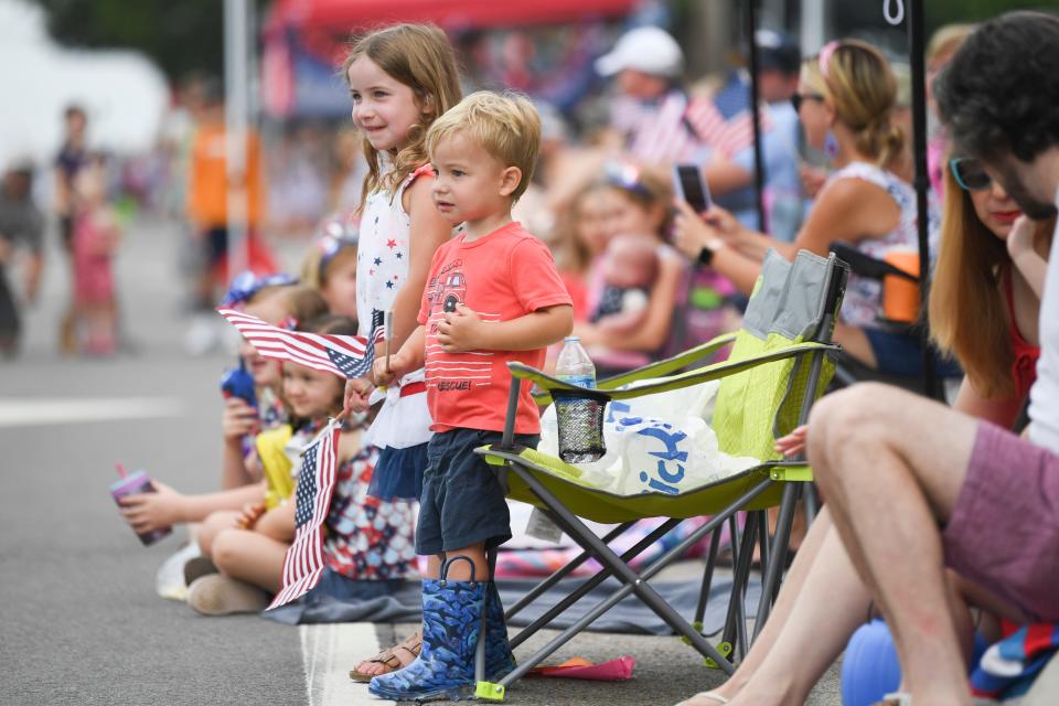 Children watch the Farragut Independence Day Parade on Kingston Pike, Tuesday, July 4, 2023.