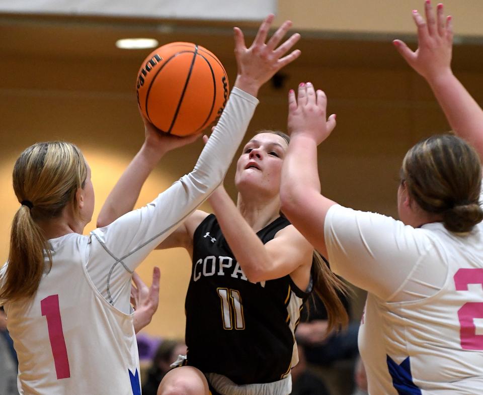 Copan High School's Kylee Cobb (11) tries to score against Shidler in playoff championship action at Wesleyan Christian School in Bartlesville on Feb. 10, 2024.