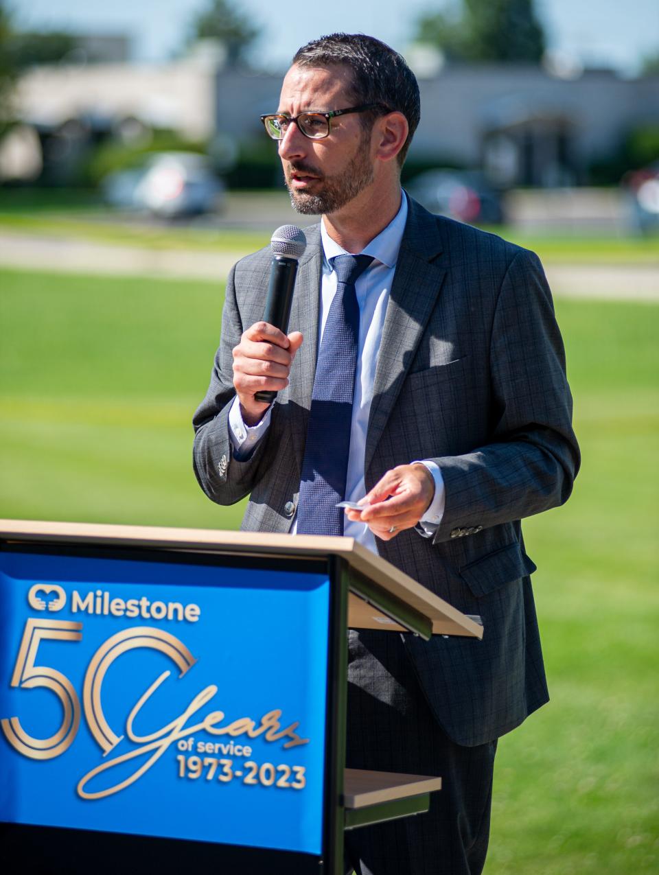 Rockford Mayor Tom McNamara talks about the City of Rockford challenge coin he brought to be included in a time capsule at Milestone Inc. on Wednesday, Aug. 16, 2023, in Loves Park.