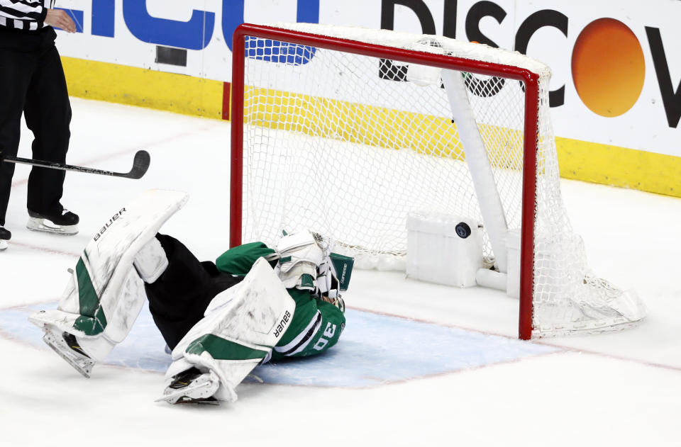 CORRECTS THAT STARS GOALTENDER BISHOP IS LAYING ON THE ICE AS A SHOT BY SCHWARTZ SCORES. DELETES REFERENCE TO BISHOP BEING HIT BY THE PUCK - A shot by St. Louis Blues' Jaden Schwartz scores as Dallas Stars goaltender Ben Bishop lies on the ice after being injured during the third period in Game 6 of an NHL second-round hockey playoff series, Sunday, May 5, 2019, in Dallas. (AP Photo/Tony Gutierrez)