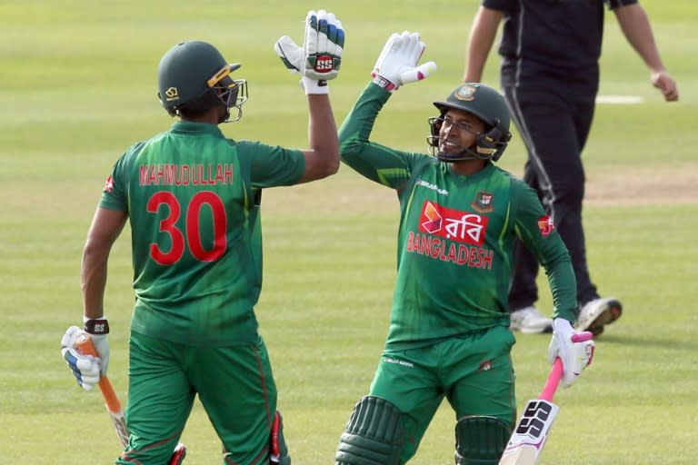 Bangladesh's Mahmudullah (L) celebrates after hitting the winning runs to beat New Zealand in the Tri-Series final One-Day International between Bangladesh and New Zealand in Dublin on May 24, 2017