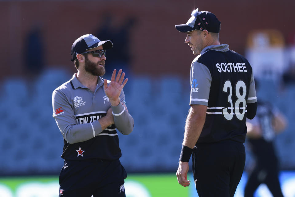 New Zealand captain Kane Williamson, left, talks to bowler Tim Southee during the T20 World Cup cricket match between New Zealand and Ireland in Adelaide, Australia, Friday, Nov. 4, 2022. (AP Photo/James Elsby)
