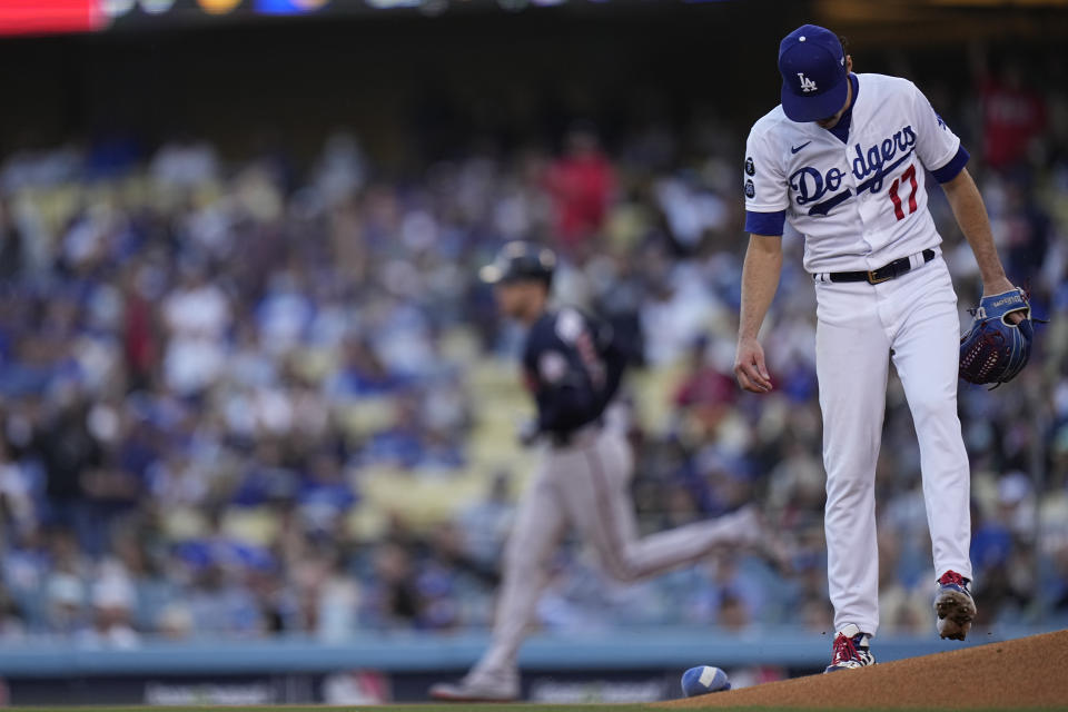 Los Angeles Dodgers pitcher Joe Kelly stands at the mound as Atlanta Braves' Freddie Freeman rounds the bases after hitting a two-run home run during the first inning against the Los Angeles Dodgers in Game 5 of baseball's National League Championship Series Thursday, Oct. 21, 2021, in Los Angeles. (AP Photo/Jae C. Hong)