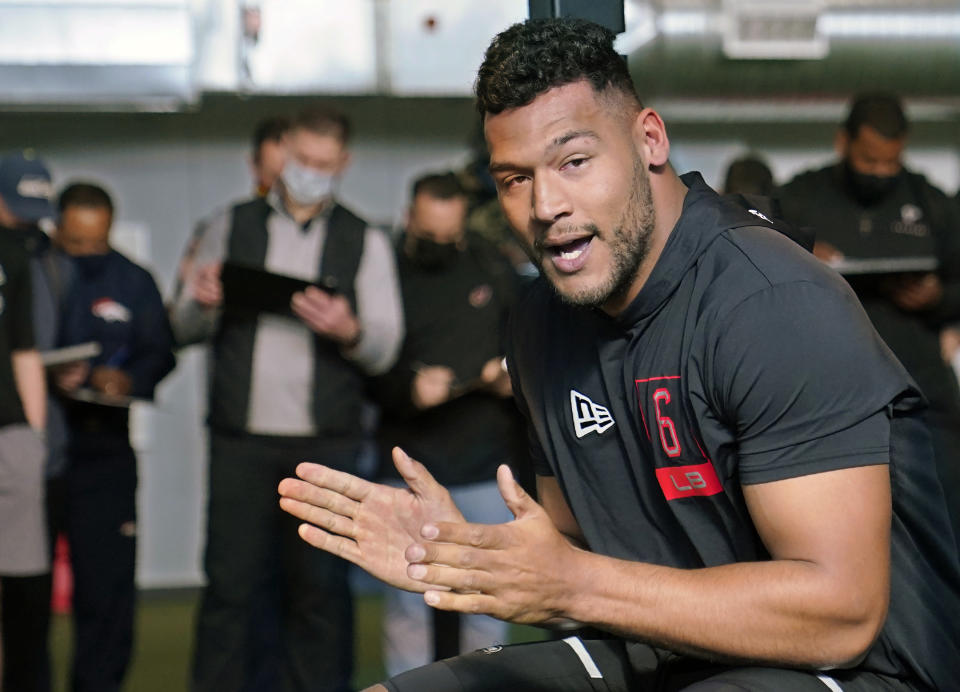 FILE - Tulsa linebacker Zaven Collins claps after completing the bench press during NFL football pro day in Tulsa, Okla., in this Friday, April 2, 2021, file photo. Collins is a possible first round pick in the NFL Draft, April 29-May 1, 2021, in Cleveland. (AP Photo/Sue Ogrocki, File)