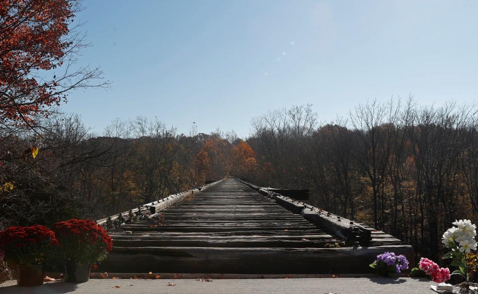 Flowers are set up in honor of Abby Williams and Libby German. The two went missing on the Monon High Bridge Trail on Feb. 13, 2017. A press conference will be held Monday to address the ongoing investigation. Photo taken, Saturday, Oct. 29, 2022, in Delphi, Ind. 