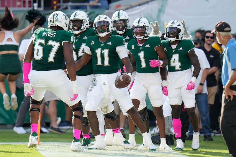 South Florida quarterback Gerry Bohanon (11) scores against Tulane during the first half of an NCAA college football game Saturday, Oct. 15, 2022, in Tampa, Fla. | Chris O’Meara, Associated Press