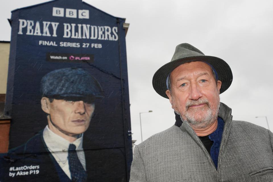 Peaky Blinders creator Steven Knight at the unveiling of a mural by artist Akse P19, of actor Cillian Murphy, as Peaky Blinders crime boss Tommy Shelby, in the historic Deritend area of Birmingham, ahead of the sixth and final series of the hit BBC One crime series. Picture date: Tuesday February 15, 2022. (Photo by Jacob King/PA Images via Getty Images)