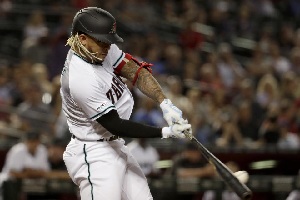 FILE - In this Sept. 17, 2019, file photo, Arizona Diamondbacks' Ketel Marte connects for a base hit against the Miami Marlins during the third inning of a baseball game in Phoenix. The D-backs feel good about their offense and it's easy to see why that's the case. Kole Calhoun, Marte, Starling Marte, Eduardo Escobar, David Peralta and Christian Walker are the core of a lineup that should have ample speed and power. (AP Photo/Matt York, File)