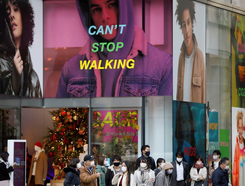 FILE PHOTO: People wear protective masks in a shopping district amid the coronavirus disease (COVID-19) outbreak in Tokyo