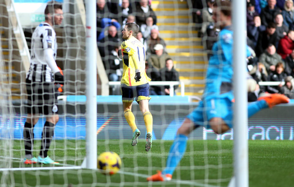 Sunderland's Adam Johnson, center, celebrates his goal during their English Premier League soccer match against Newcastle United at St James' Park, Newcastle, England, Saturday, Feb. 1, 2014. (AP Photo/Scott Heppell)