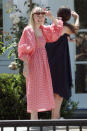 <p>Dakota Fanning is all smiles at her new home in Los Angeles on Saturday.</p>