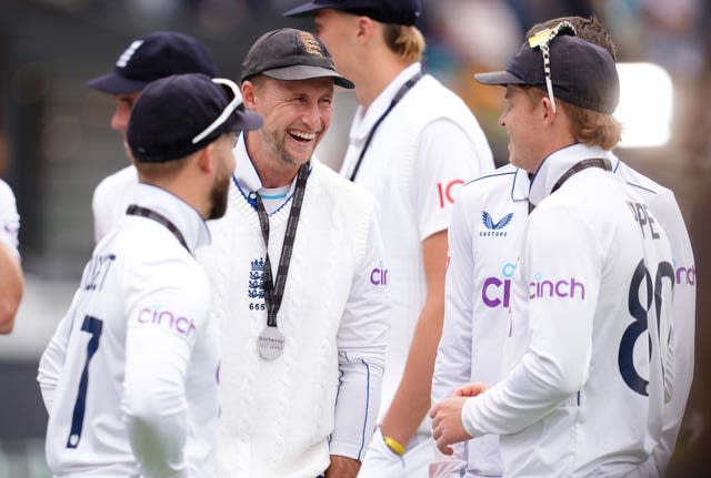 England’s Joe Root laughs with team-mates Ollie Pope and Ben Duckett