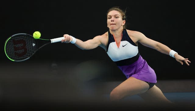 Simona Halep stretches for a forehand during her defeat by Serena Williams