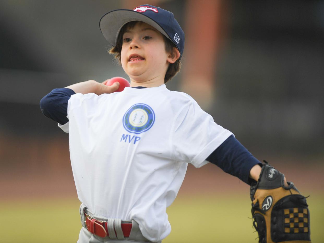 Will Clark, 7 years old with Down syndrome, practices before he throws the first pitch during the WES's Game match in The Ball Park at Jackson, in Jackson, Tenn., on Thursday, March 21, 2024.