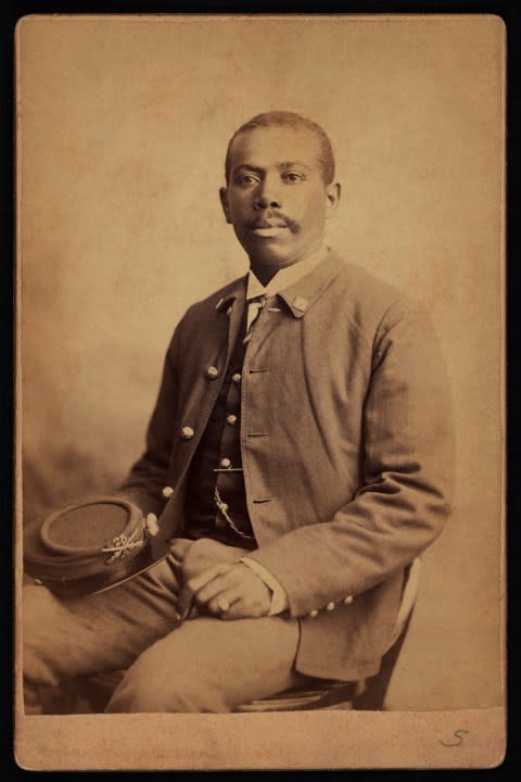 Buffalo Soldier, 25th Infantry, Seated Portrait in Uniform Holding Hat, by Orlando Scott Goff, William A Gladstone Collection of African American Photographs, 1880s. (Photo by: Glasshouse Vintage/Universal History Archive/Universal Images Group via Getty Images)
