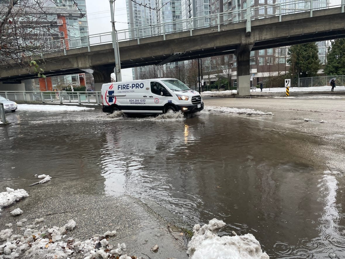 Authorities have issued a flood watch for Metro Vancouver since Saturday, Christmas Eve, after a rainstorm followed a week of piled-up snow in the region.  (Kuljeet Kaila/CBC - image credit)