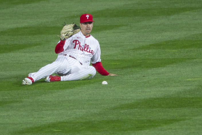 Philadelphia Phillies center fielder Adam Haseley (40) misses a ball hit for a single during the fourth inning of a baseball game, Monday, April 5, 2021, in Philadelphia. (AP Photo/Laurence Kesterson)