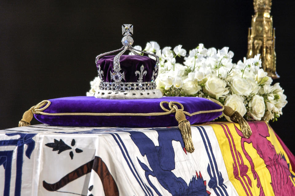 The Queen Mother's coffin, the wreath of white flowers and the Queen Mother's coronation crown with the priceless Koh-I-Noor diamond on April 8, 2002. (Tim Graham / Corbis via Getty Images file)