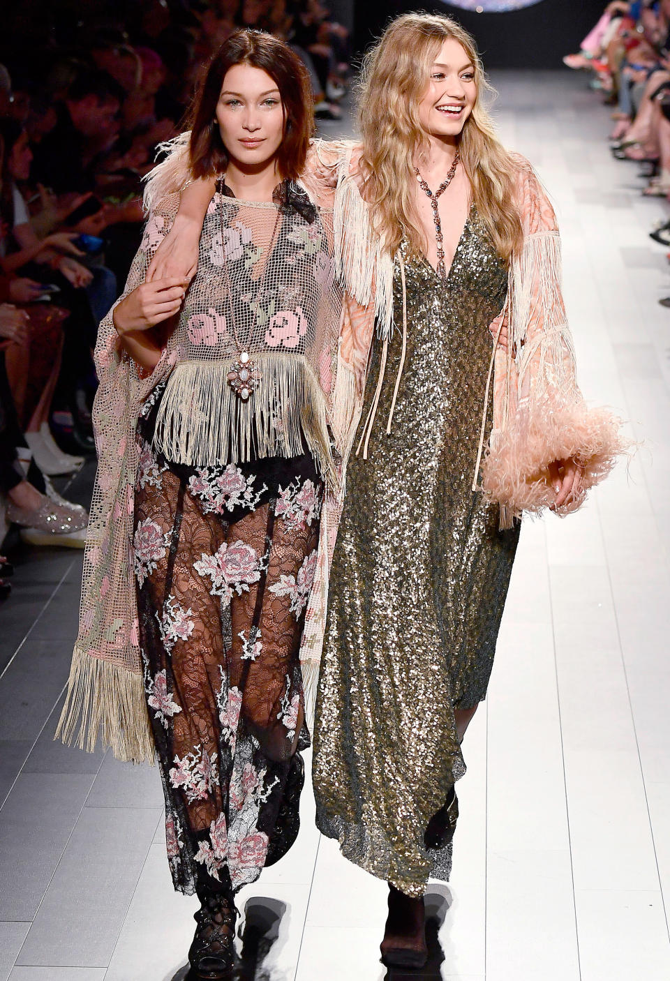 <p>After Gigi was sent down the runway without a shoe, Bella helped her big sis down the catwalk at Anna Sui.</p>