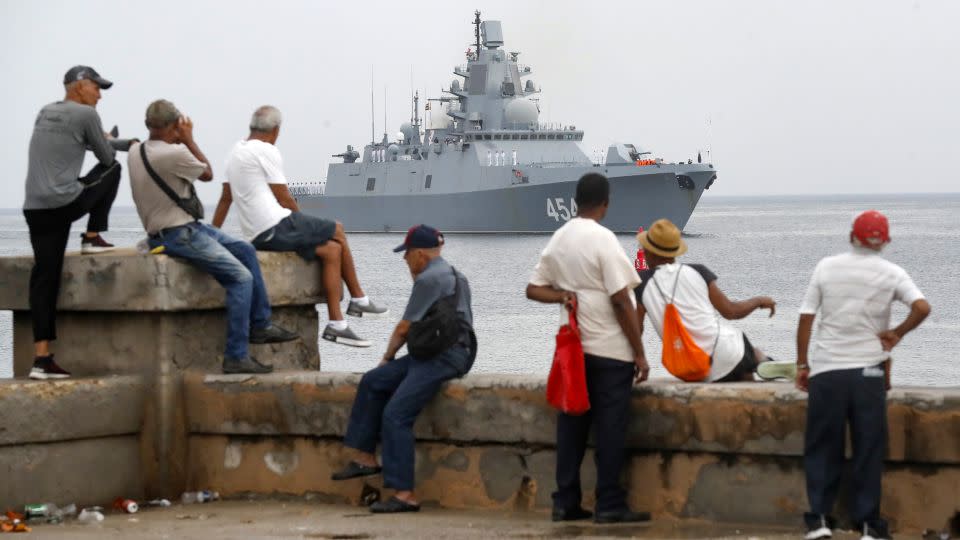 People watch a ship belonging to the Russian Navy flotilla arrive at the port of Havana on Wednesday, June 12, 2024, in Havana, Cuba. - Yander Zamora/Anadolu/Getty Images