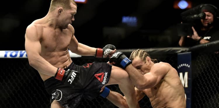 Peter Yan knees Urijah Faber at UFC 245