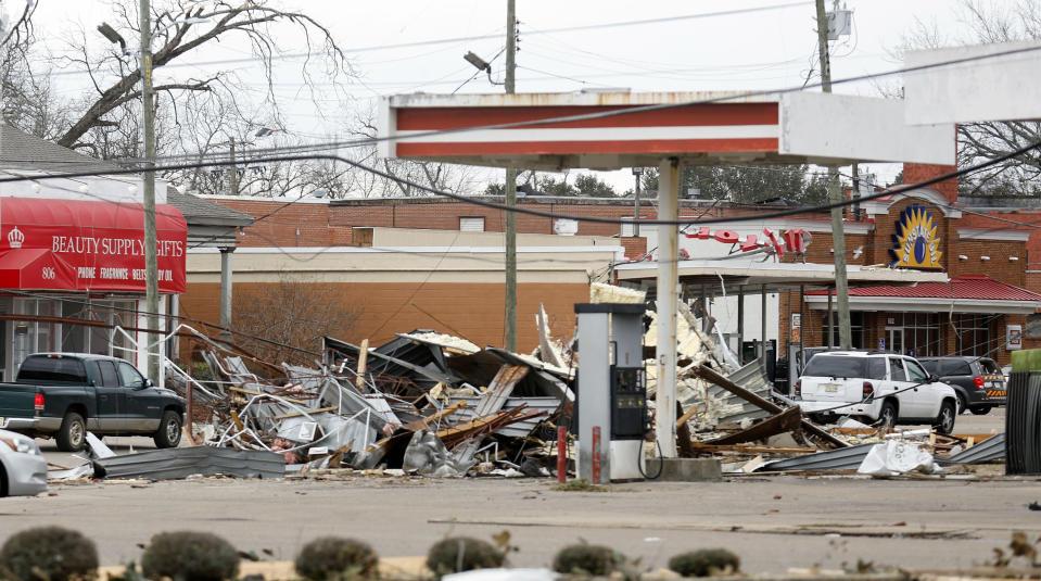 Debris from local business is strewn about in Selma, Ala., Friday, Jan. 13, 2023, after a tornado passed through the area the day before. Rescuers raced Friday to find survivors in the aftermath of a tornado-spawning storm system that barreled across parts of Georgia and Alabama. (AP Photo/Stew Milne)