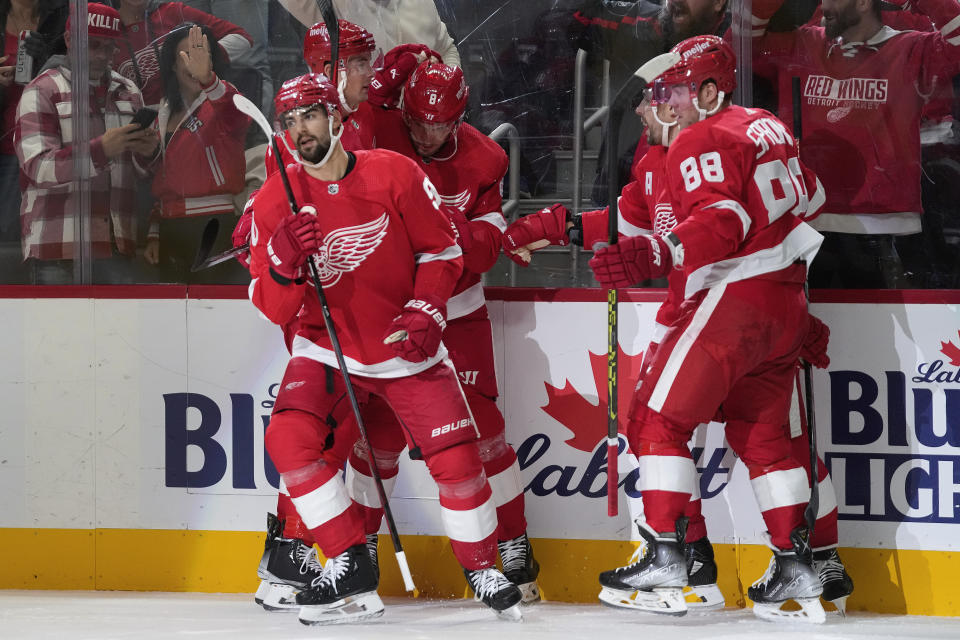 Detroit Red Wings center Joe Veleno (90) celebrates his goal against the Calgary Flames in the first period of an NHL hockey game Sunday, Oct. 22, 2023, in Detroit. (AP Photo/Paul Sancya)