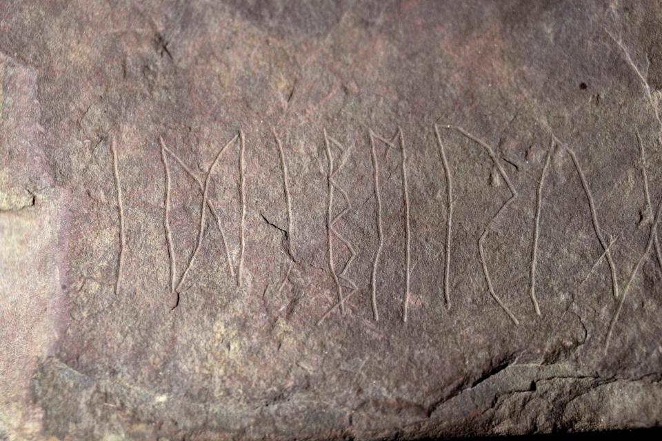 Inscriptions can be seen in the rune stone found at Tyrifjorden, Norway, shown at the Museum of Cultural History in Oslo, on Jan. 12, 2023.