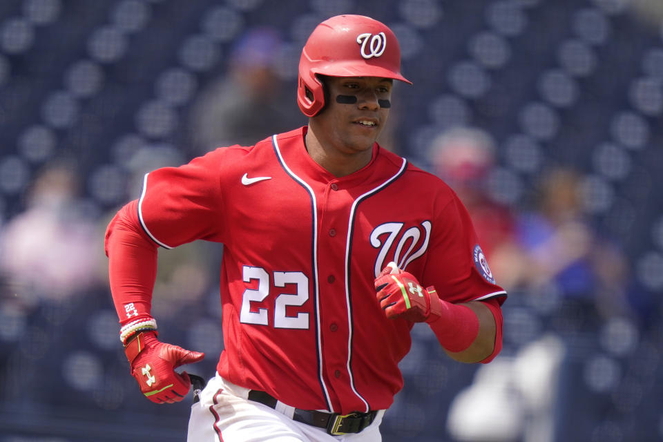 Washington Nationals' Juan Soto (22) runs after hitting a single during the first inning of a spring training baseball game against the New York Mets, Monday, March 8, 2021, in West Palm Beach, Fla. (AP Photo/Lynne Sladky)
