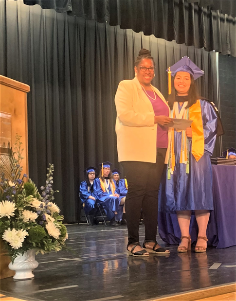 From left, Nanette Sanders-Cobb of the Climbers Club and scholarship recipient Phu Aung.