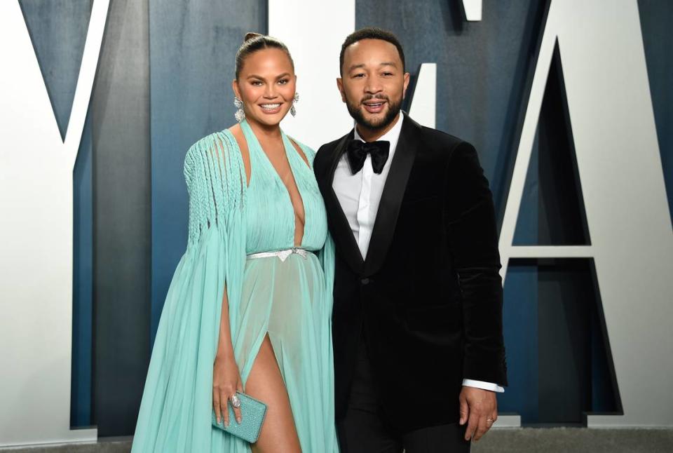 FILE - Chrissy Teigen and John Legend arrive at the Vanity Fair Oscar Party last year in Beverly Hills, Calif. (Photo by Evan Agostini/Invision/AP, File)