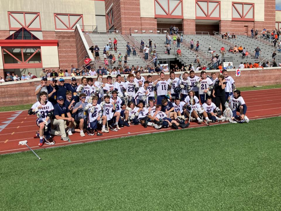 Chenango Forks' Blue Devils in the aftermath of a state-semifinal win against Akron, June 8, 2022.