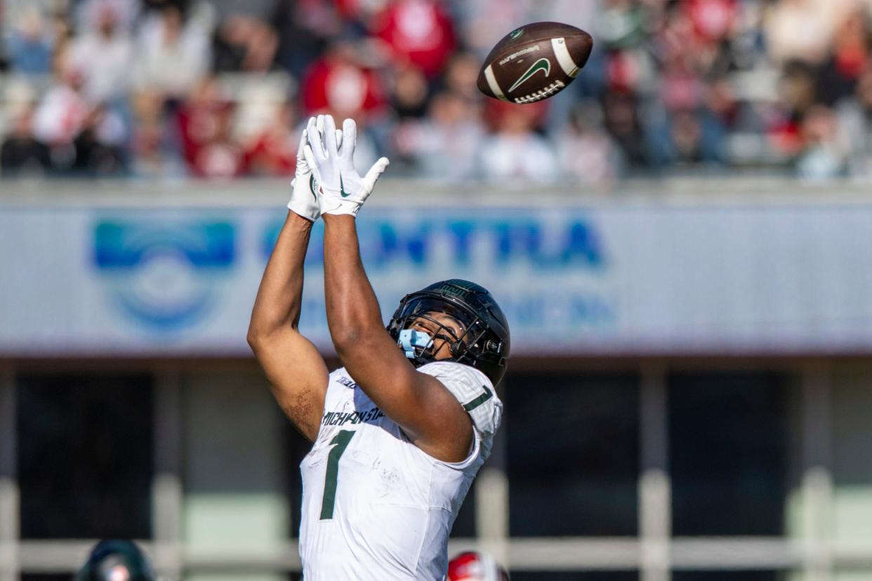 Michigan State running back Jaren Mangham reaches for a pass during the game against Indiana on Saturday, Nov. 18, 2023, in Bloomington, Indiana.