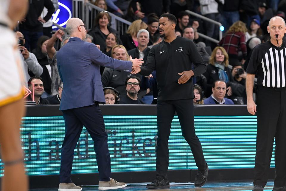 Connecticut head coach Dan Hurley, left, and Providence head coach Kim English shake hands after a game in March at Amica Mutual Pavilion.