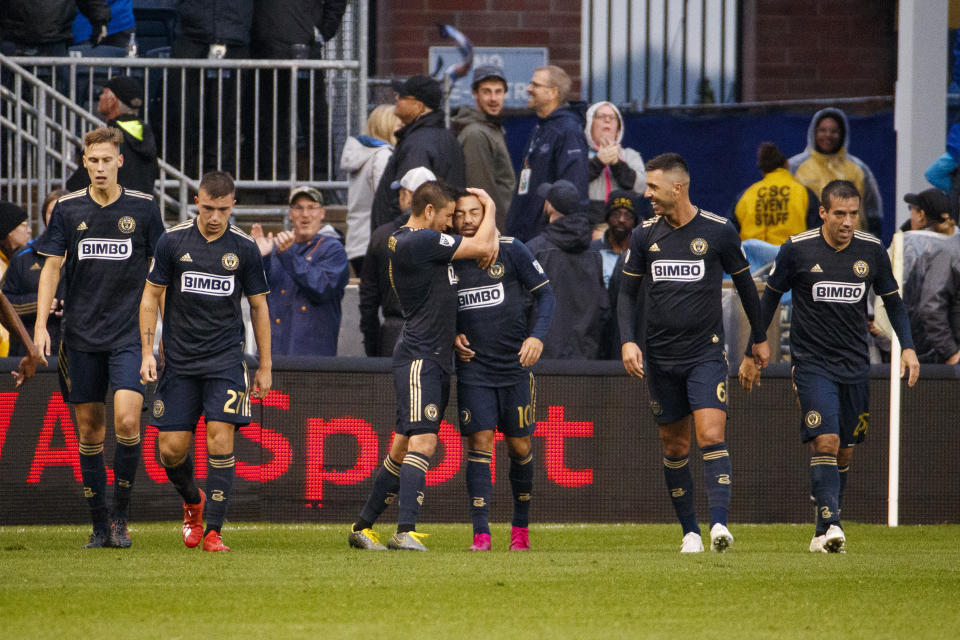 Philadelphia Union's Marco Fabian (10) celebrates his goal with teammates during extra time of an MLS soccer Eastern Conference first-round playoff match against the New York Red Bulls, Sunday, Oct. 20, 2019, in Chester, Pa. (AP Photo/Chris Szagola)