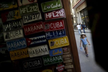 A young U.S. visitor walks on a street in Havana March 16, 2016. REUTERS/Ueslei Marcelino