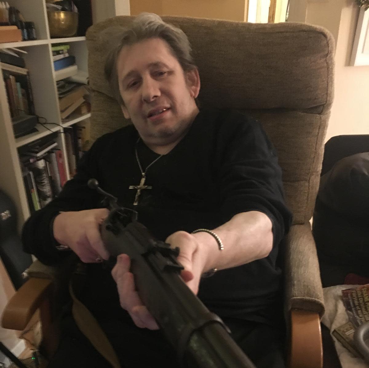 <span>Shane MacGowan with his beloved rifle.</span><span>Photograph: Victoria Mary Clarke</span>