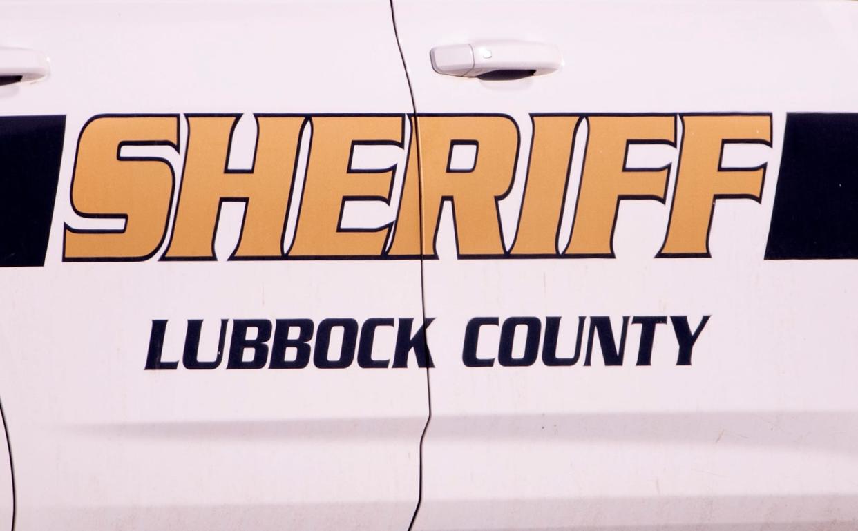 Lubbock County Sherriff's Office SWAT takes a suspect into custody after a standoff at 61st Street and Avenue Q Wednesday, Feb. 15, 2023.