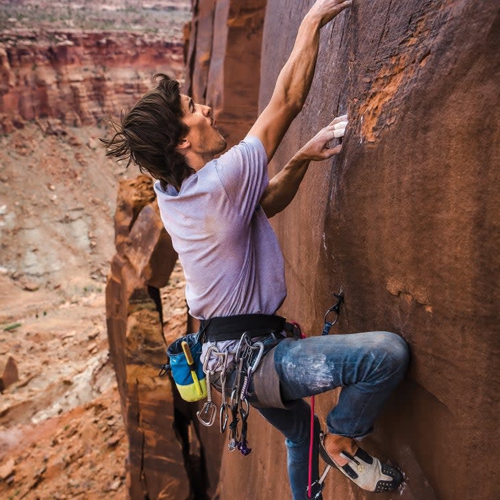 Earle doing a first ascent of Ringlock Ranch, near Moab, Utah.
