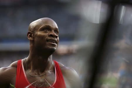 Asafa Powell of Jamaica celebrates after he win the men's 100 metres at during the IAAF Diamond League athletics meeting at the Stade de France Stadium in Saint-Denis, near Paris, France, July 4, 2015. REUTERS/Stephane Mahe