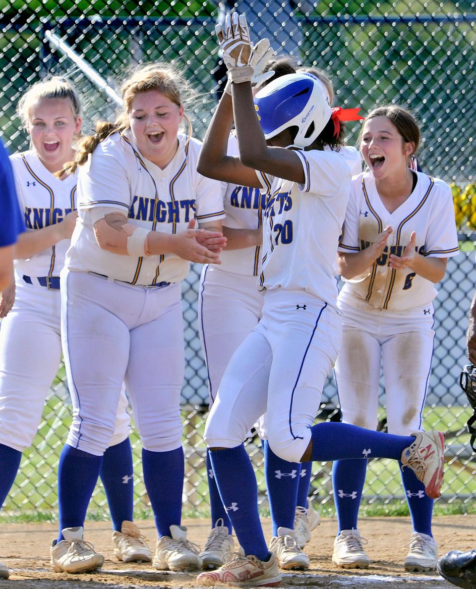Sussex Central's Takyla Davis is swarmed by her teammates after blasting a solo homer against Conrad in the second round of the DIAA Softball Tournament on May 19. The Golden Knights will play at Appoquinimink in the semifinals at 5 p.m. Wednesday.